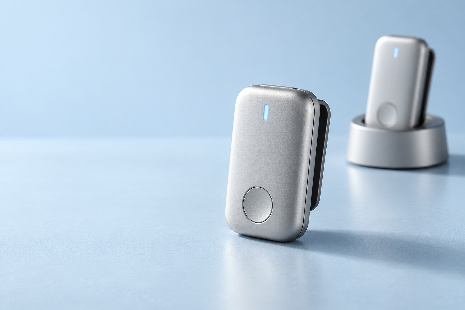 TokenValley Carry concept: a silver magnetic personal-agent clip beside its desktop dock